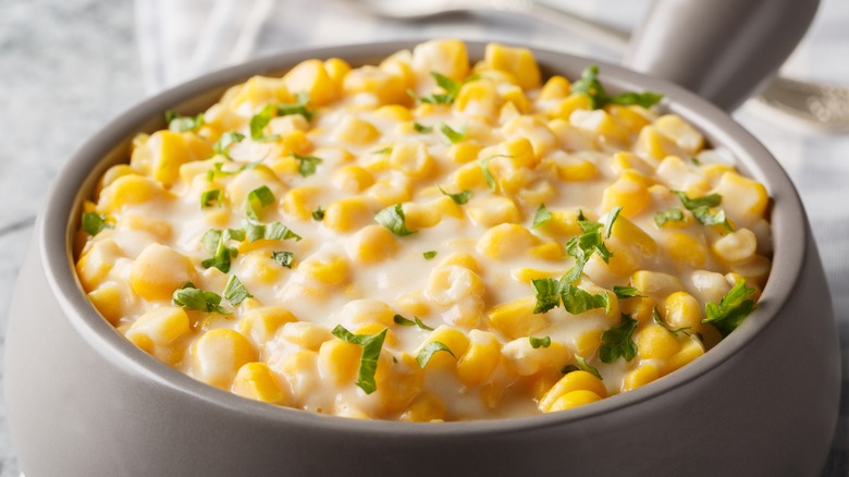 close on bowl full of cheesy corn