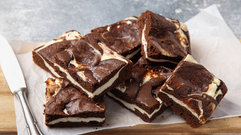 Layered brownies on parchment paper