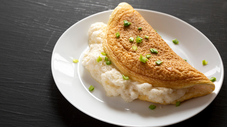 soufflé omelet on plate with garnish