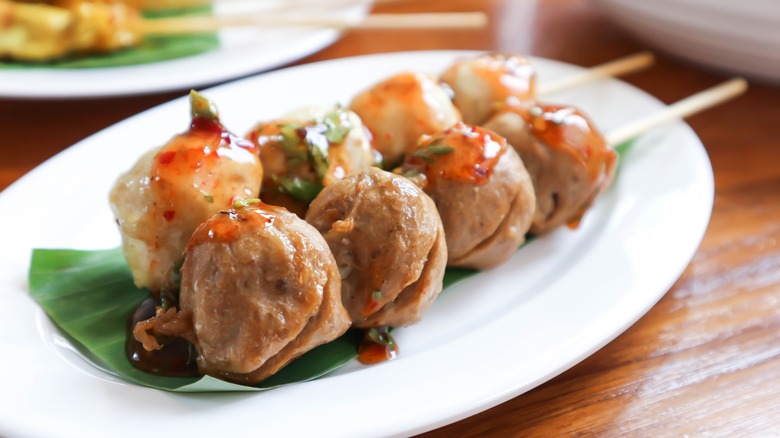 Plated and skewered Thai meatballs