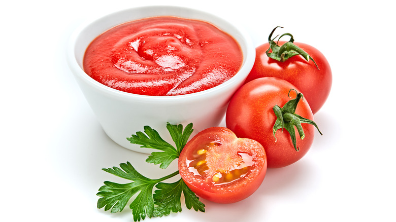 Red tomato puree in a white cup