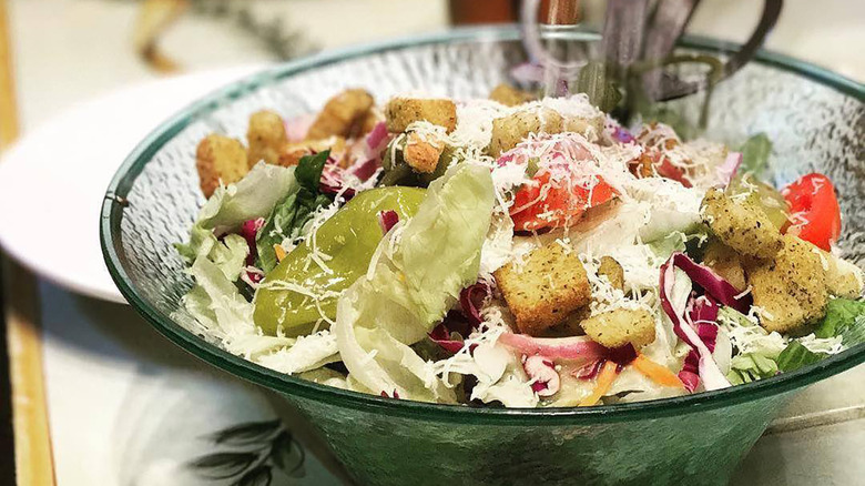 olive garden salad served in clear bowl