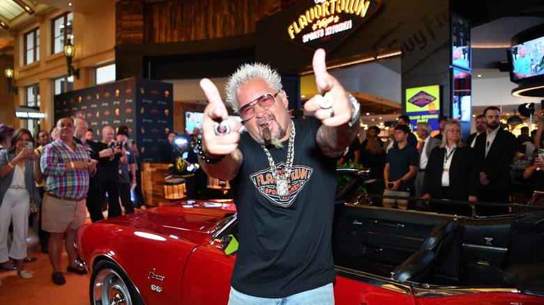 Guy Fieri doing finger guns at Flavortown