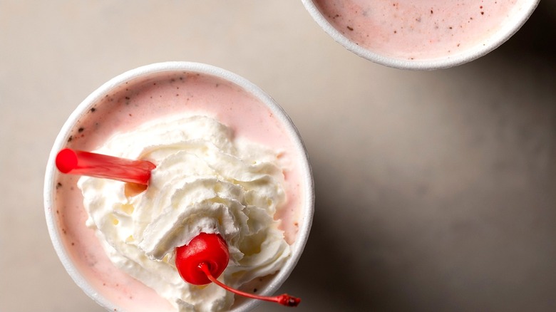 two strawberry Chick-fil-A milkshakes