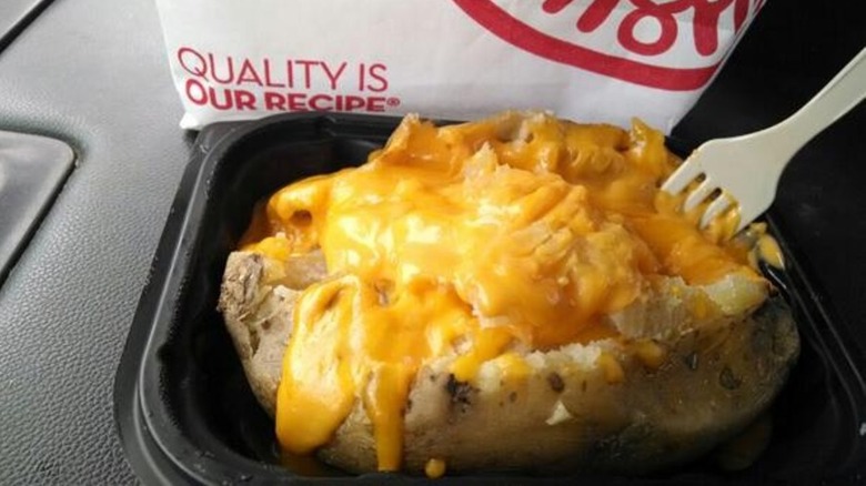Wendy's potato overflowing with cheese