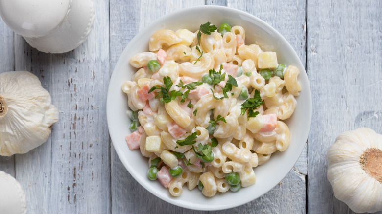 Macaroni salad with mayo, tomatoes, green onion and parsley