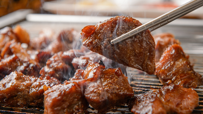 Korean barbecue held by chopsticks