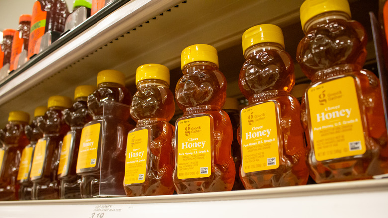 Jars of honey on shelf