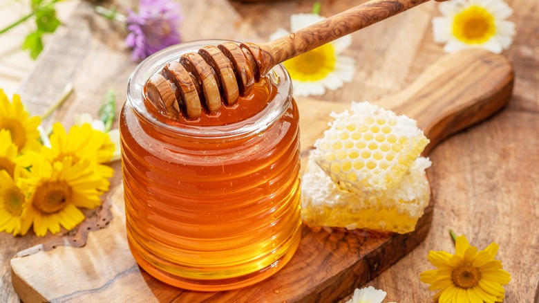 Glass jar of honey