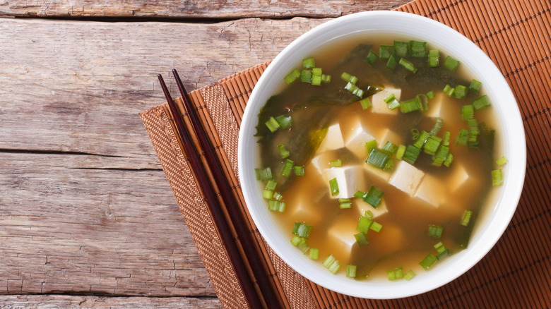 light miso soup in white bowl