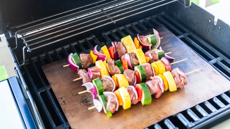 beef skewers on grill mat