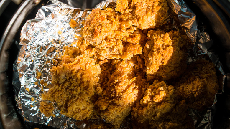 Fried chicken in air fryer with foil