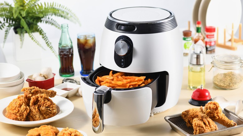 Air fryer with food around