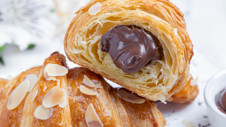 Croissant filled with chocolate and sprinkled with almonds