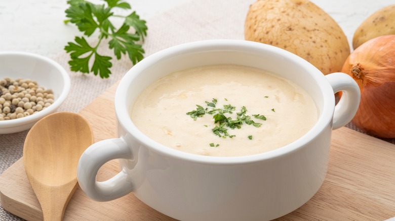 creamy potato soup on wooden plate