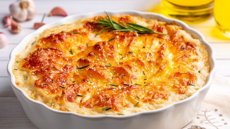 cheesy potato casserole white scalloped dish