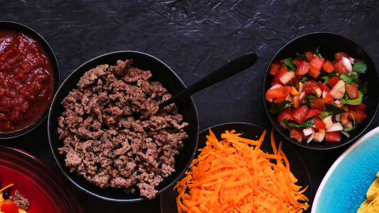 ground beef, pico de gallo, salsa, cheese in bowls