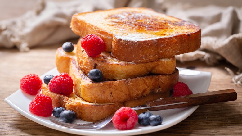 stack of french toast and berries