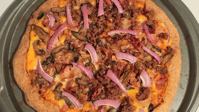 Meaty pizza on a pan