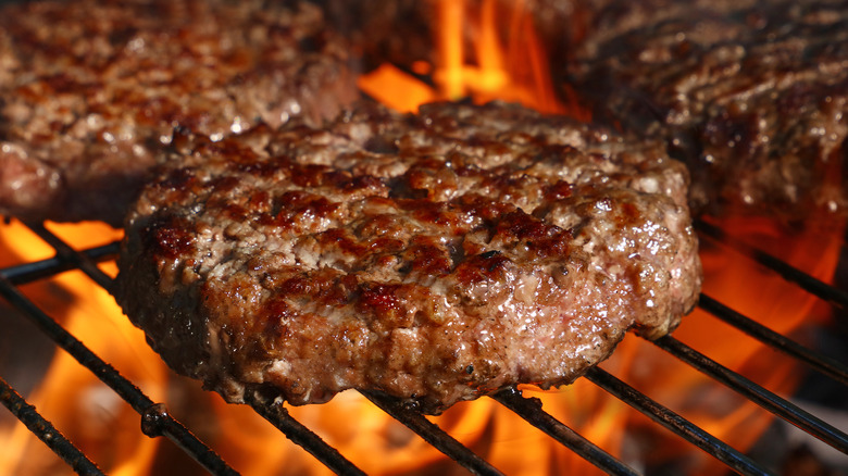 Close up of beef patty on grill