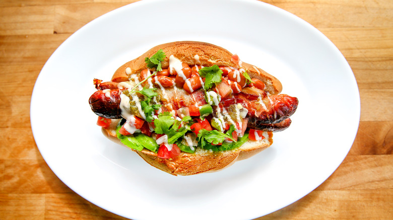 Sonoran hot dog on white plate