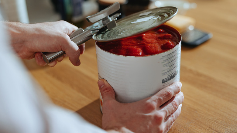 opening canned tomatoes