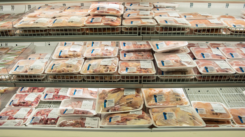 Packages of meat on shelves
