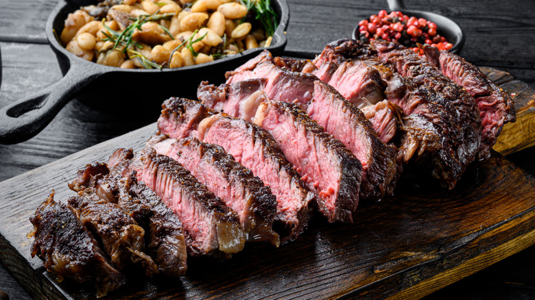 Sliced steak on a wooden board