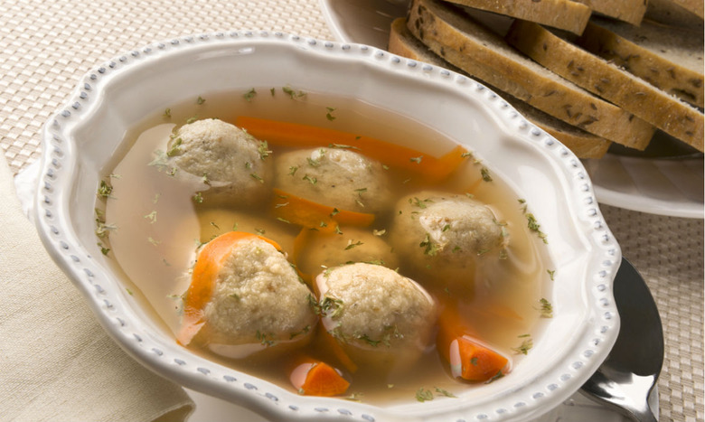 https://www.thedailymeal.com/img/gallery/what-to-serve-for-a-tasty-traditional-passover-feast/Matzo%20Soup%20MAIN.jpg