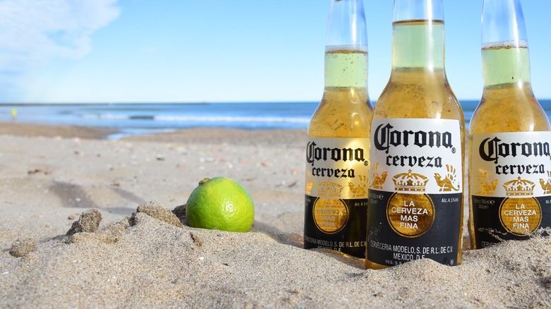 Corona bottles in the sand