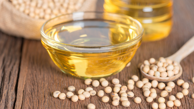 soy oil in dish and beans on table