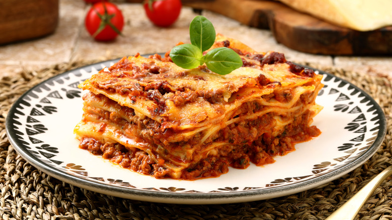 lasagna topped with sprig of basil