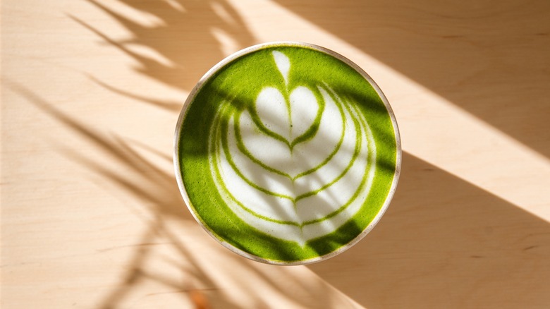 Creamy matcha latte with pattern on top