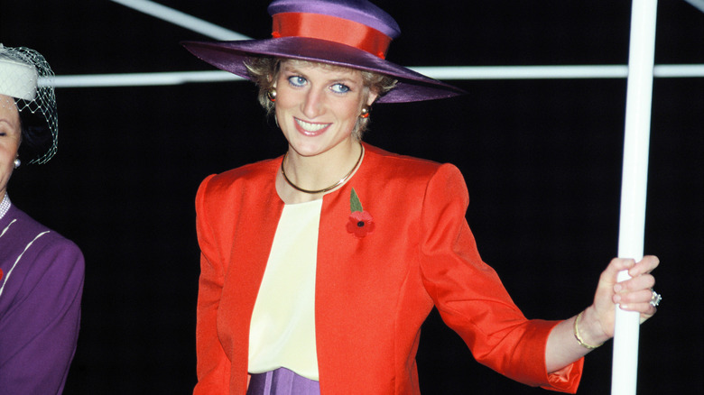 Princess Diana smiling in red