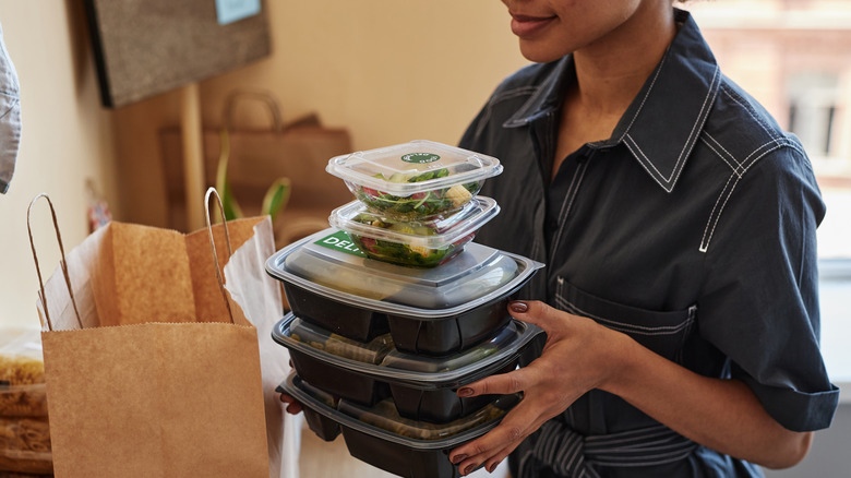 Person unpacking takeout order