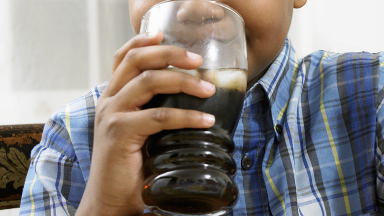 Kid drinking soda