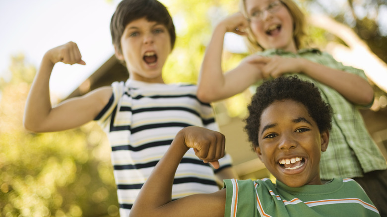 kids showing their muscles