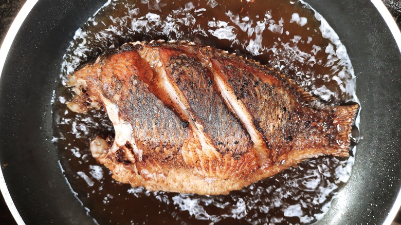 Cooked tilapia in a pan