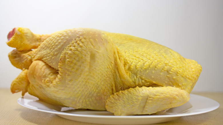 A whole, yellow chicken