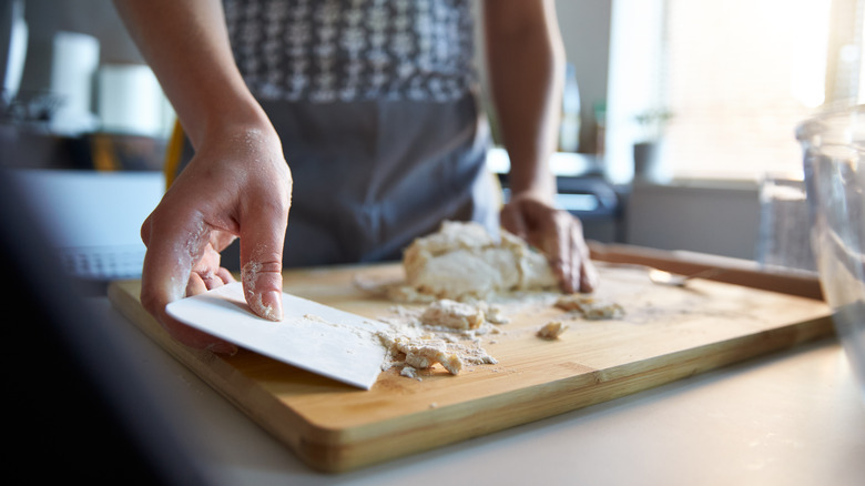 Using dough scraper