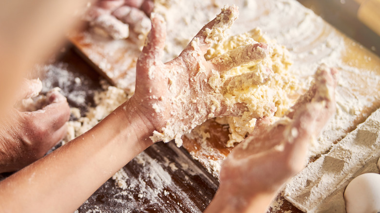 Working sticky dough by hand