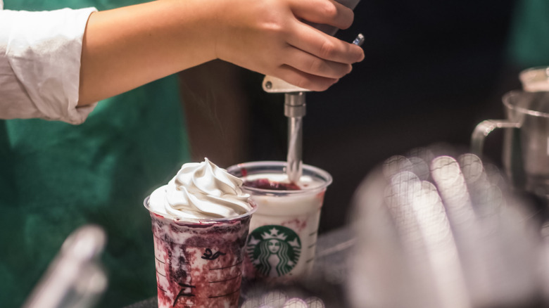 Starbucks barista making drink