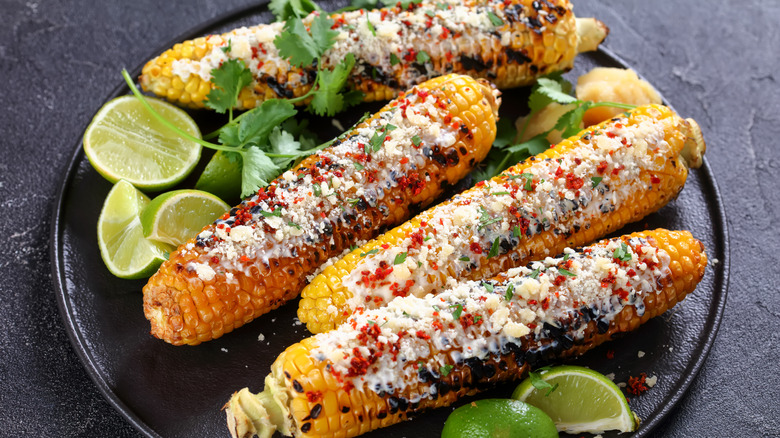 plate of elotes with lime