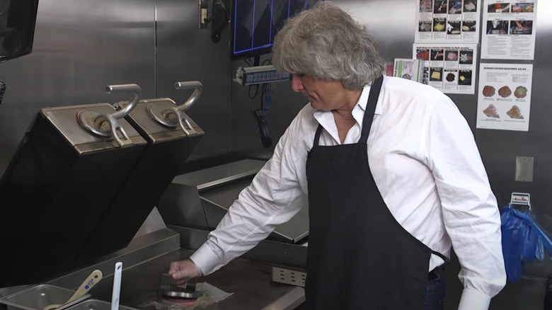 Tom Ryan cooking smashburger on griddle