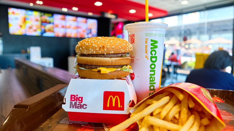 McDonald's hamburger, drink, and fries in a restaurant