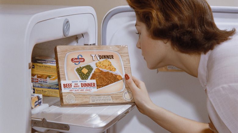 women with TV dinner advertisement