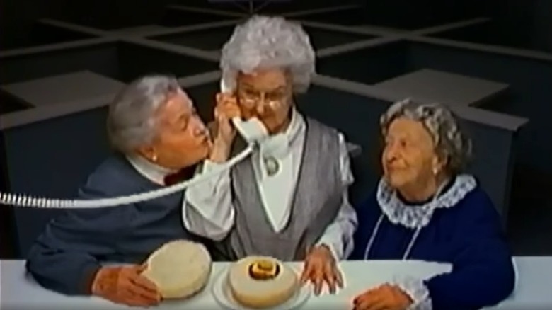 Three old women with a telephone