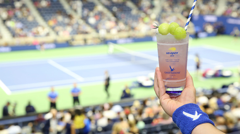 person holding honey deuce cocktail at US Open