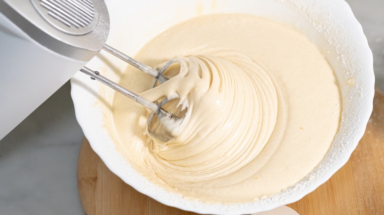 Hand mixer beating cake batter