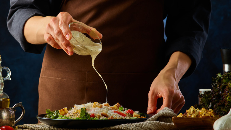 chef making caesar salad